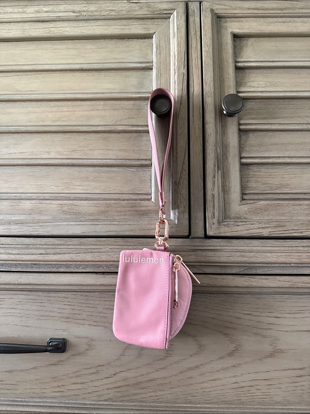 lululemon blush pink wristlet key pouch with rose-gold hardware